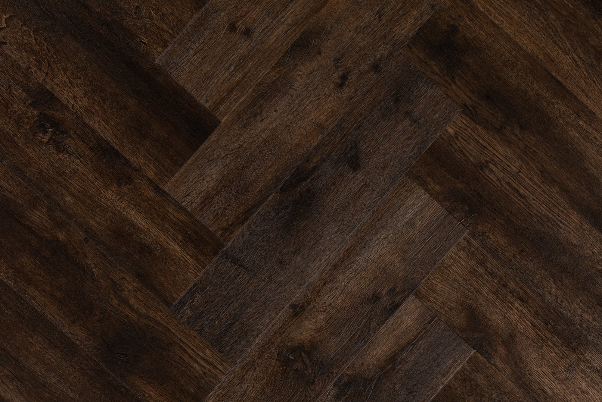 Burnt Cocoa Glue Down Herringbone parquet hardwood flooring from our Vinyl Flooring collection